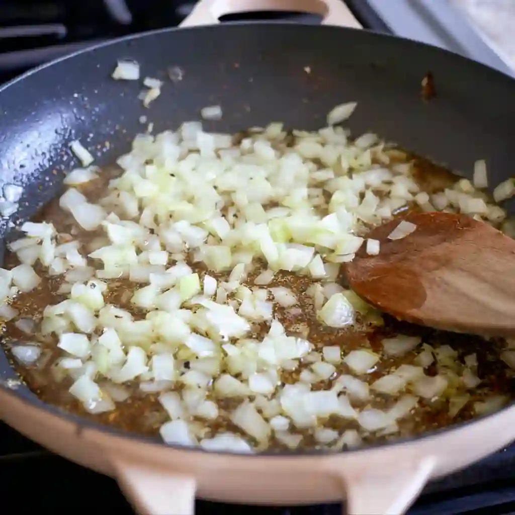Overhead view of fully cooked squash and zucchini in a cast iron pot